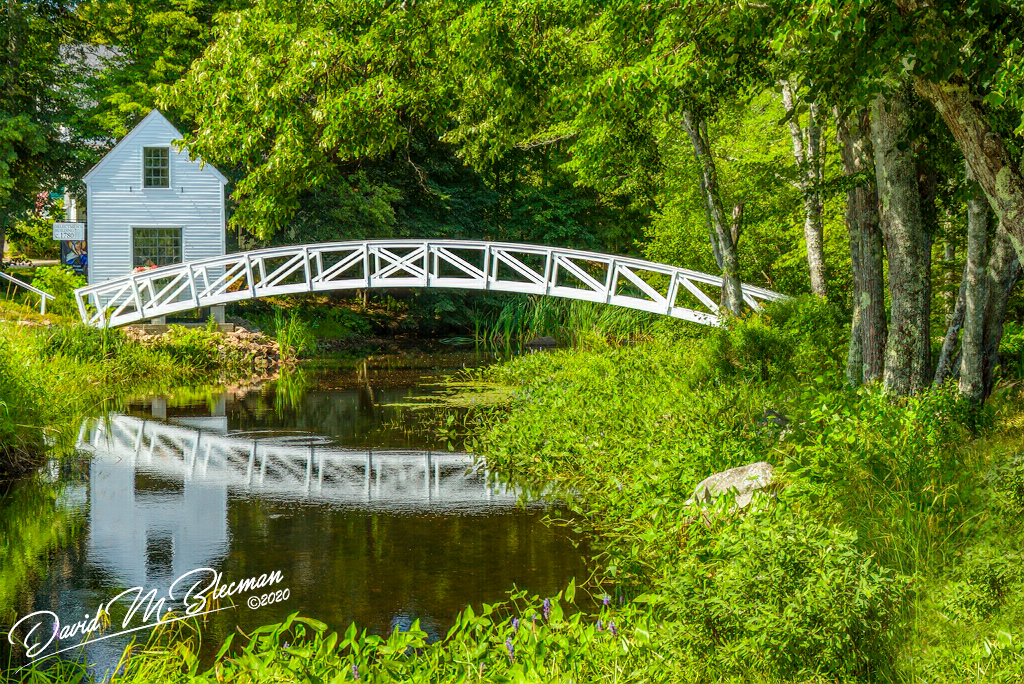 A picture quaint walking bridge in the Maine countryside 